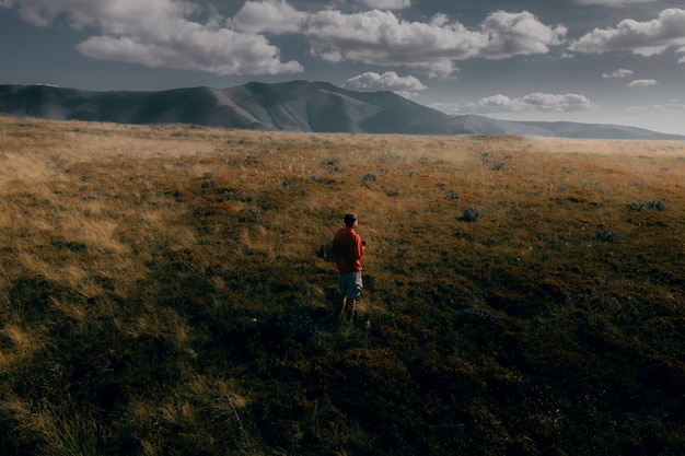 Borzhavsky Range Carpathians Ukraine Mountain landscape Guy on a background of mountains