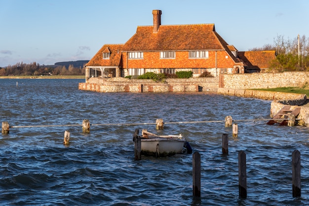 BOSHAM, WEST SUSSEX/UK - January 1 : Impressive house bathed in sunshine at Bosham West Sussex on January 1, 2013