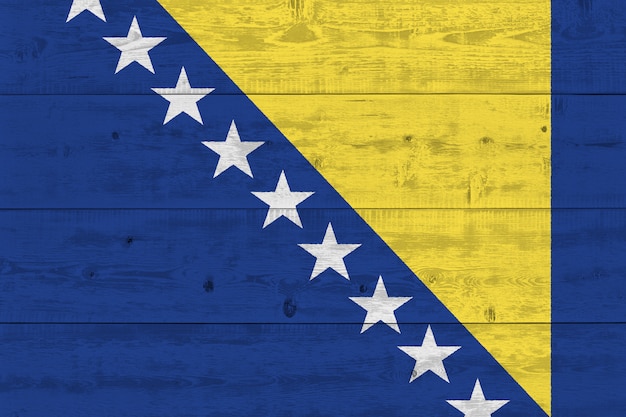 Bosnia and Herzegovina flag painted on old wood plank