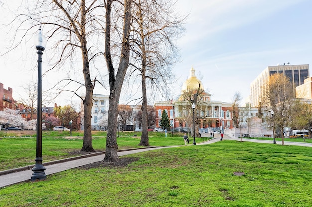 Boston, USA - April 29, 2015: State Library of Massachusetts and people in Boston Common public park in downtown Boston, MA, United States. People on the background