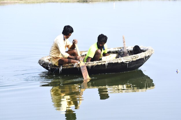 A bot and bot men in river