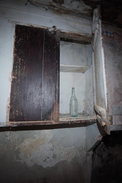 A bottle in a cabinet