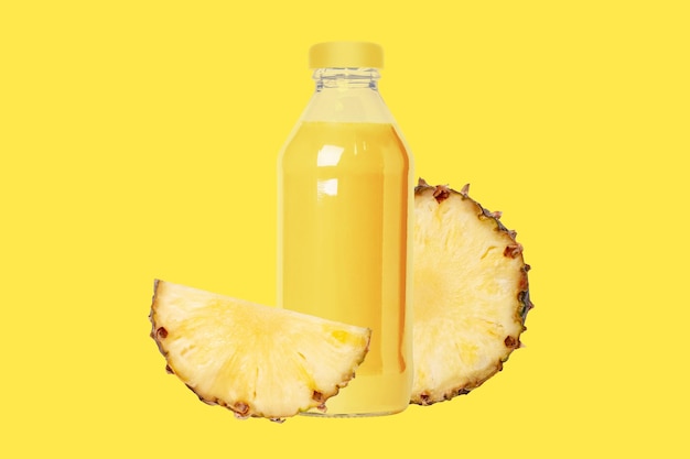 Bottle of freshly squeezed pineapple juice Pieces of fresh juicy half pineapple ring On a yellow background