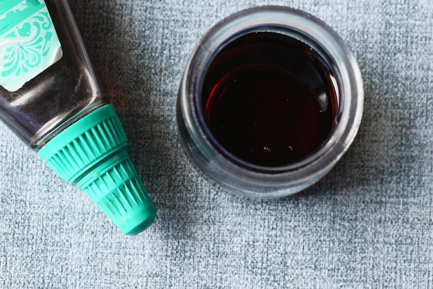 Bottle of maple syrup on table