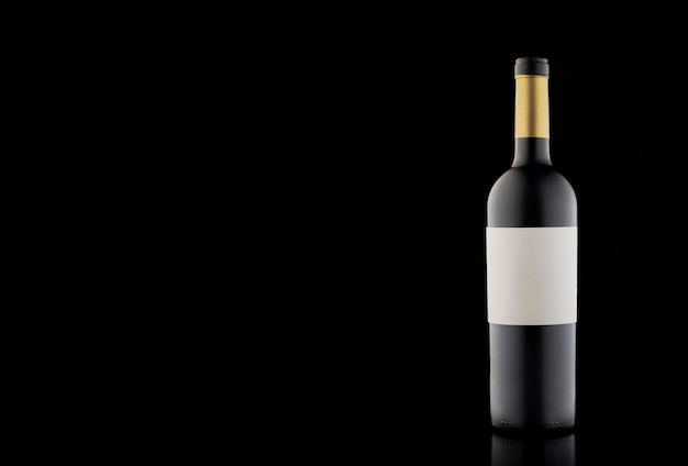 A bottle of wine with a beautiful highlight and gradient on a black empty background