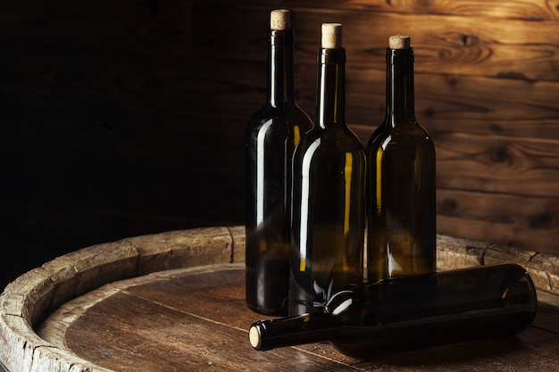 bottle of wine over wooden background