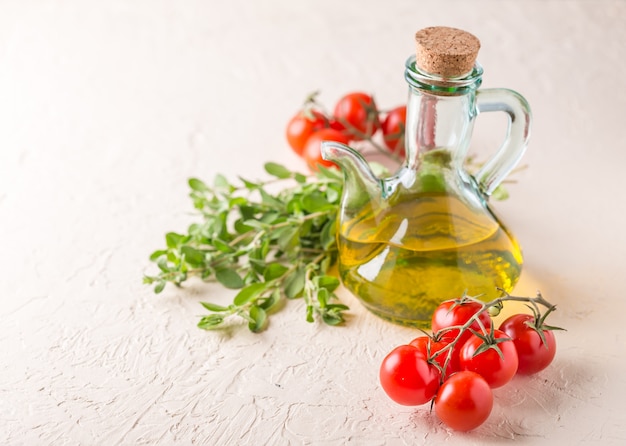 Bottle with vegetable oil and cherry tomatoes