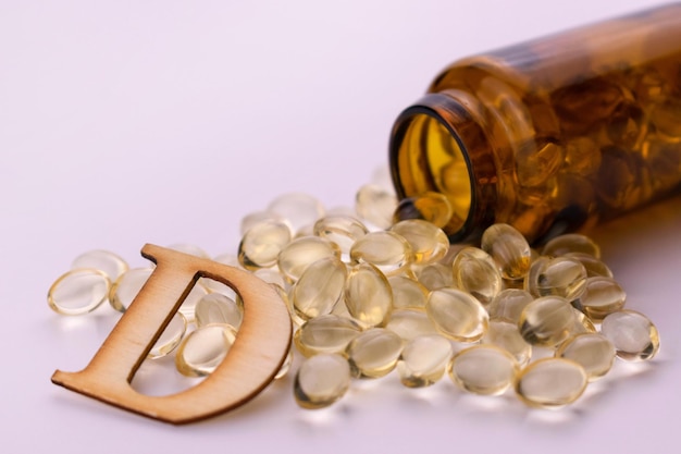 Bottle with vitamin D on a white background Closeup