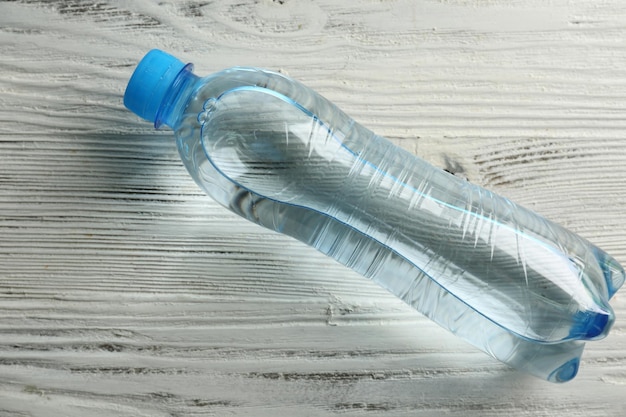 Bottled water on the wooden table top view