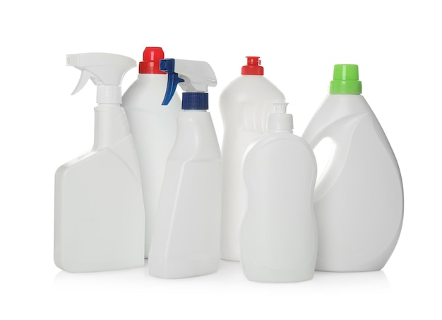 Bottles of different cleaning products on white background