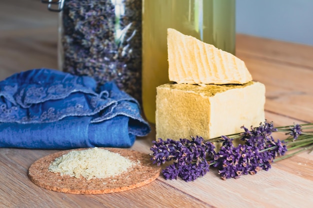 Bottles of homemade laundry on a table Marseille grated soap DIY do it yourself zero waste eco friendly natural product for wash and cleaning