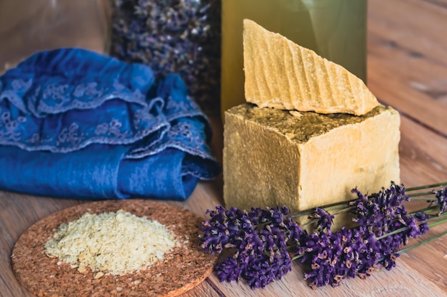 Bottles of homemade laundry on a table with lavender Marseille grated soap DIY do it yourself zero waste eco friendly natural product for wash and cleaning