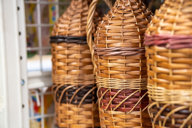 Bottles, wine jugs, jars braided with rattan wood vine