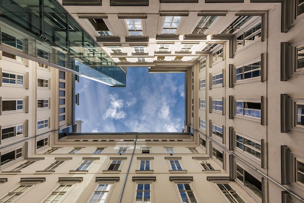 Bottom up view from the rectangular courtyard of a modern highrise building Vienna Austria