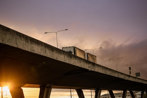 Bottom view of elevated concrete highway with truck driving Overpass concrete road Road flyover