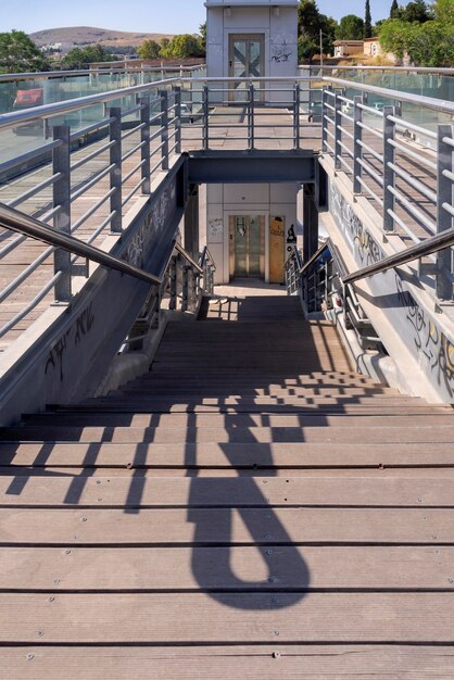 Bottom view marble steps up with metal railings in the city in Greece