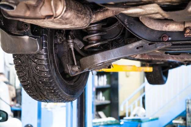 Bottom view of wheel and shock absorber of vehicle