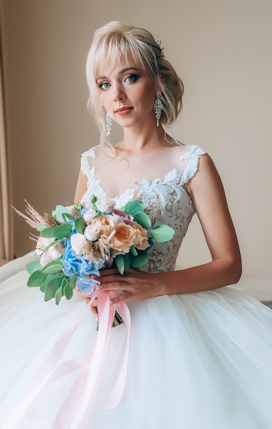 Boudoir of the bride. charming bride in the morning in a negligee prepares for the celebration