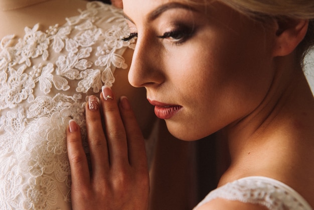 Boudoir of the bride. charming bride in the morning in a negligee prepares for the celebration