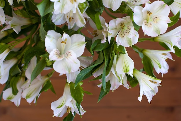 Bouquet of Alstroemeria flowers on green background Wedding anniversary greeting card concept