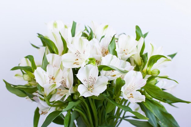 Bouquet of Alstroemeria flowers on green background Wedding anniversary greeting card concept