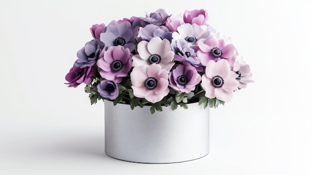 Bouquet of anemones in an elegant metal vase on a light background