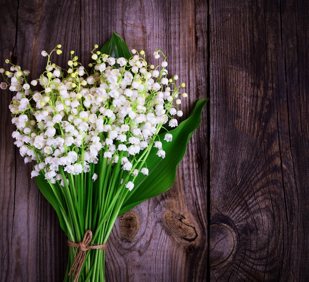 Bouquet of blossoming lilies of the valley 