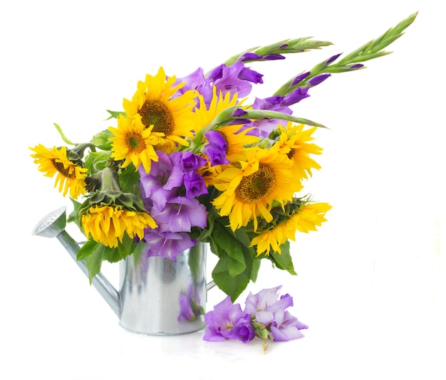 Bouquet of bright sunflowers with gladioluses isolated on whute