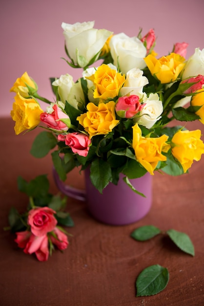 Bouquet of colorful roses in a vase