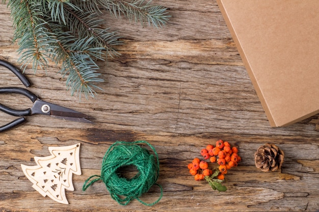 A bouquet of fir branches on an old wooden background. Preparing for Christmas. Natural gifts