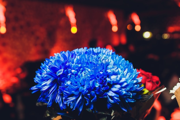 Bouquet flower in vase of glass. Decoration of dining table.