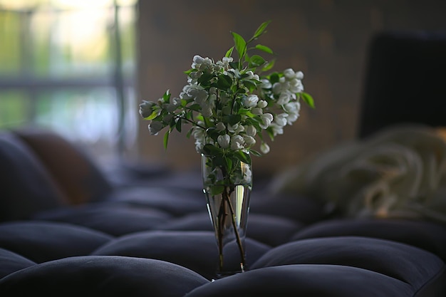 bouquet flowers of apple tree branches in a vase, a beautiful bouquet in the spring loft interior