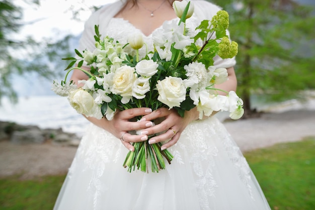 Bouquet of flowers in the hand of the bride Bride holding her wedding bouquet