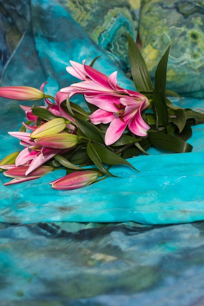 A bouquet of flowers is lying on the bed Romance fragrant pink lilies