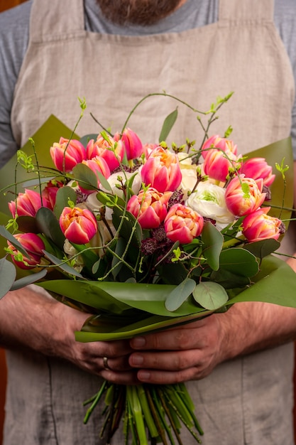 Bouquet of flowers in men's hands