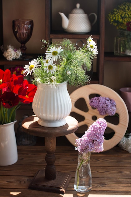 Bouquet of flowers on a wooden background Rustic style concept and flower shop