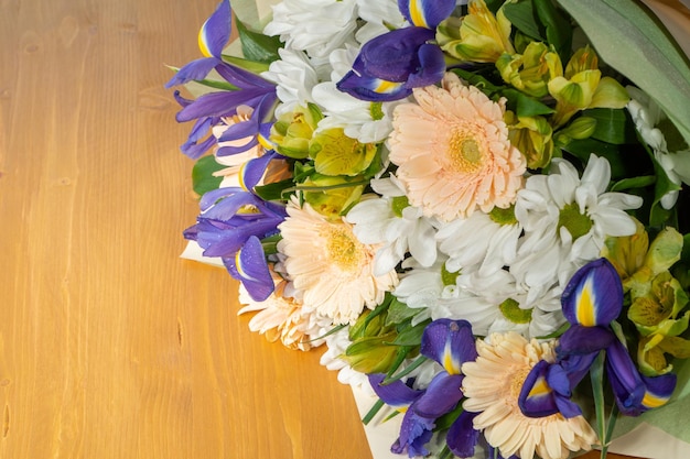 A bouquet of flowers on a wooden table