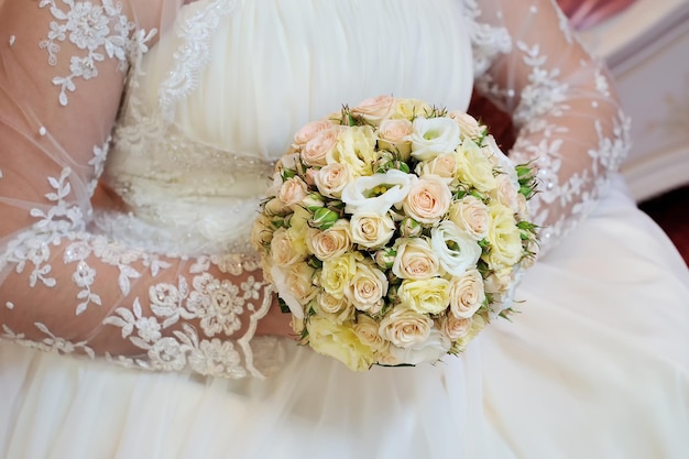 Bouquet in the hands of the bride