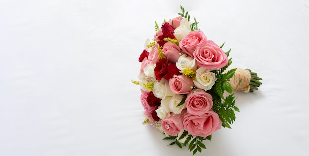 Bouquet of multicolored roses for a wedding on a white background