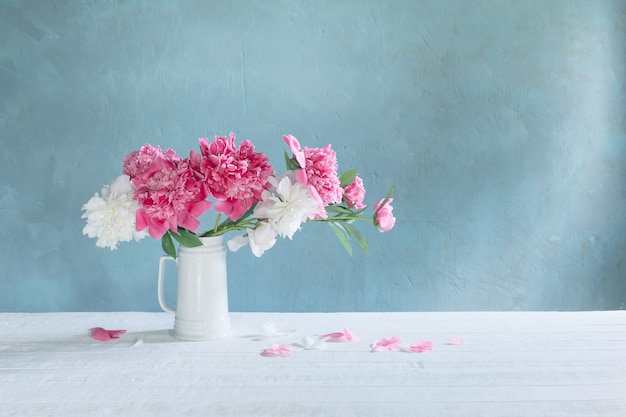 Bouquet of pink and white peonies  on wall