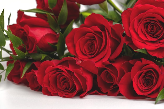 Bouquet of red roses on a white table