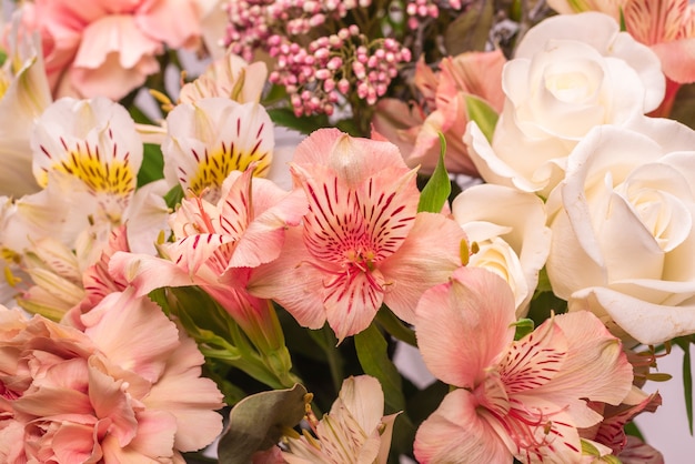 Bouquet of soft pink flowers in pink wrapping paper