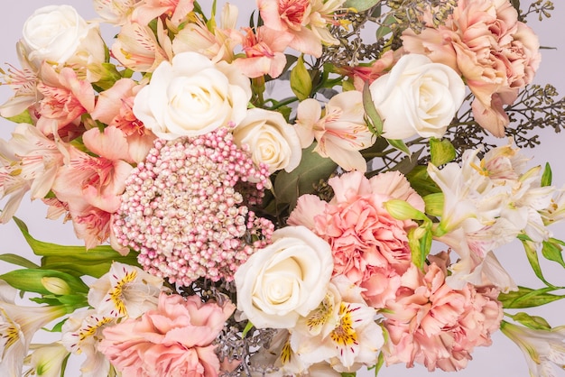 Bouquet of  soft pink flowers in pink wrapping paper.