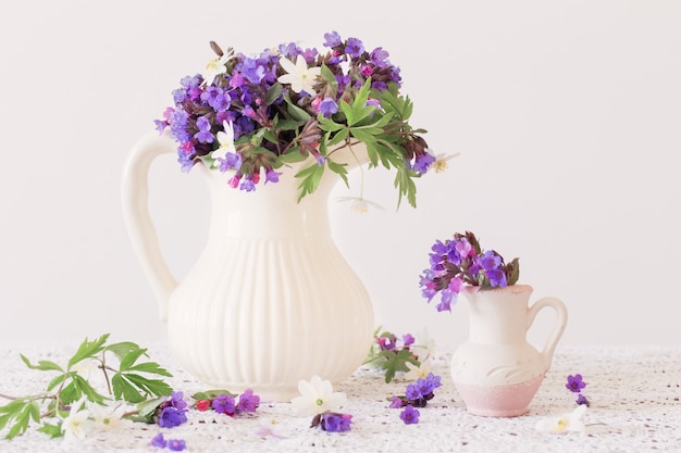 Bouquet of spring flowers in a jug