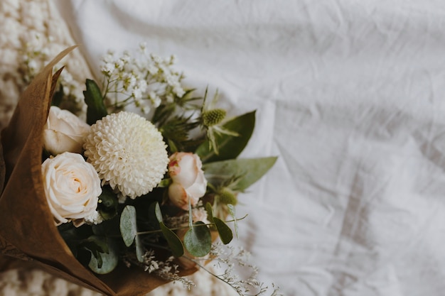 A bouquet of white dahlia and roses