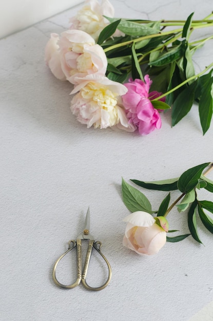 Bouquet of white peonies on the table