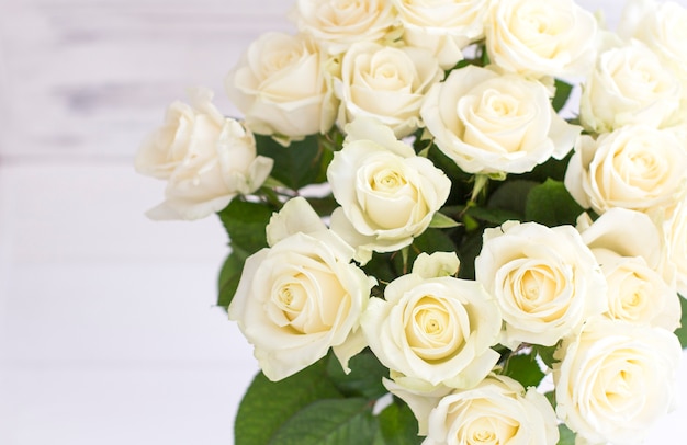 Bouquet of white roses in a vase. Bouquet of chic white roses