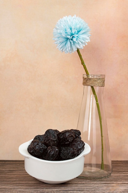 A bowl of Ajwa dates, popular during fasting month. Selective focus points. Blurred background