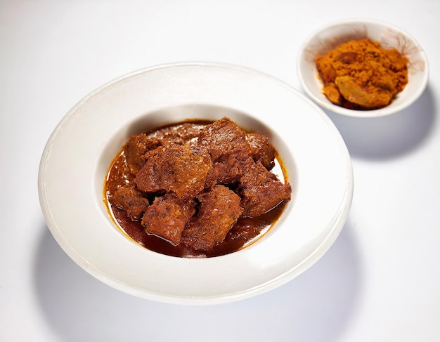 A bowl of beef stew or rendang an Indonesian dish made with beef spices and coconut milk