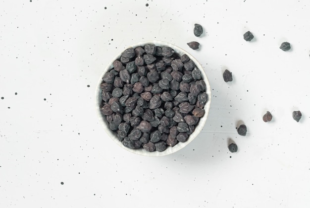 A bowl of blueberries on a white background